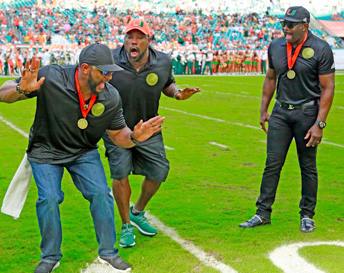 Sapp (center) with Ray Lewis and Michael Irvin at the October Ring of Honor ceremony.